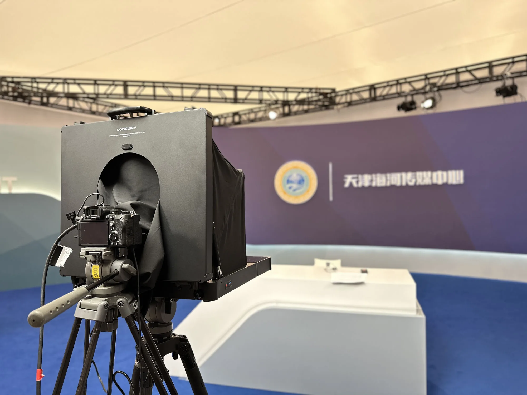 PROMPTERGO Portable Teleprompter on a broadcast camera at an on-site studio production